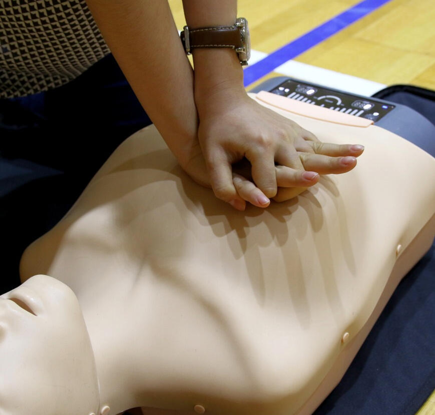 CPR being performed on a training dummy